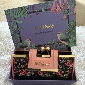 Large beautiful wallet pink and black with flowers on it brand new